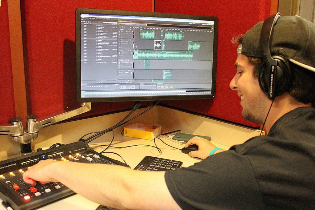 Madison Miller / staff photo                                Max Tanzer prepares 88.9 KMIH The Bridges transformation into Log Boom Radio for Seafair.