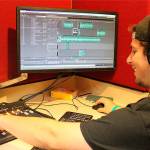 Madison Miller / staff photo                                Max Tanzer prepares 88.9 KMIH The Bridges transformation into Log Boom Radio for Seafair.