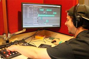 Madison Miller / staff photo                                Max Tanzer prepares 88.9 KMIH The Bridges transformation into Log Boom Radio for Seafair.