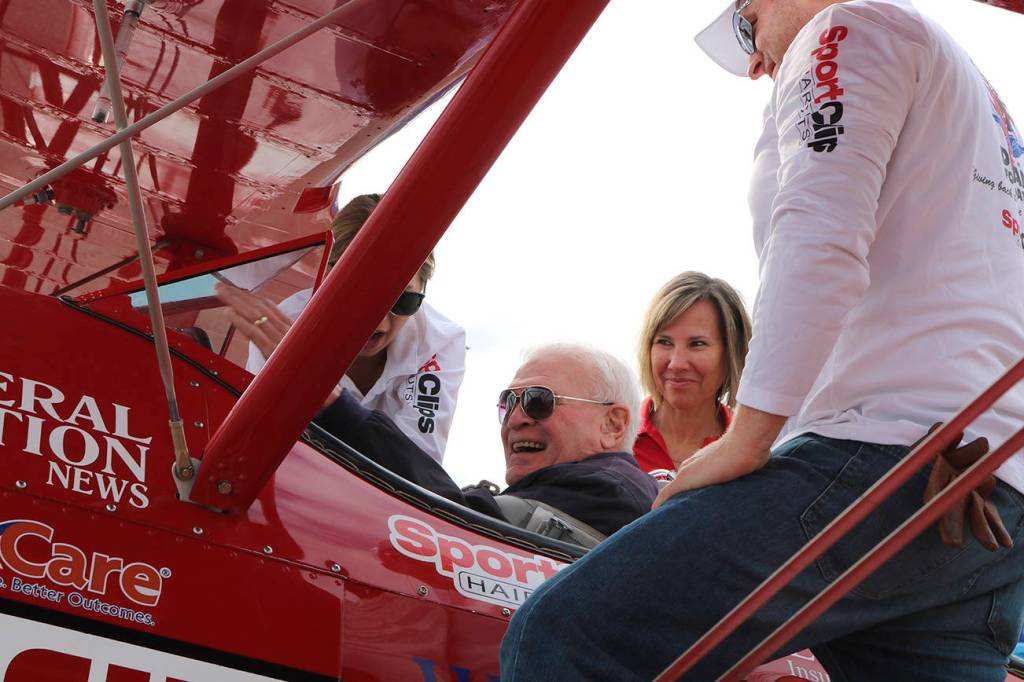Ageless Aviation Dreams Foundation team members help Jack Nelson get settled in the cockpit on Aug. 12. Stephanie Quiroz/staff photo