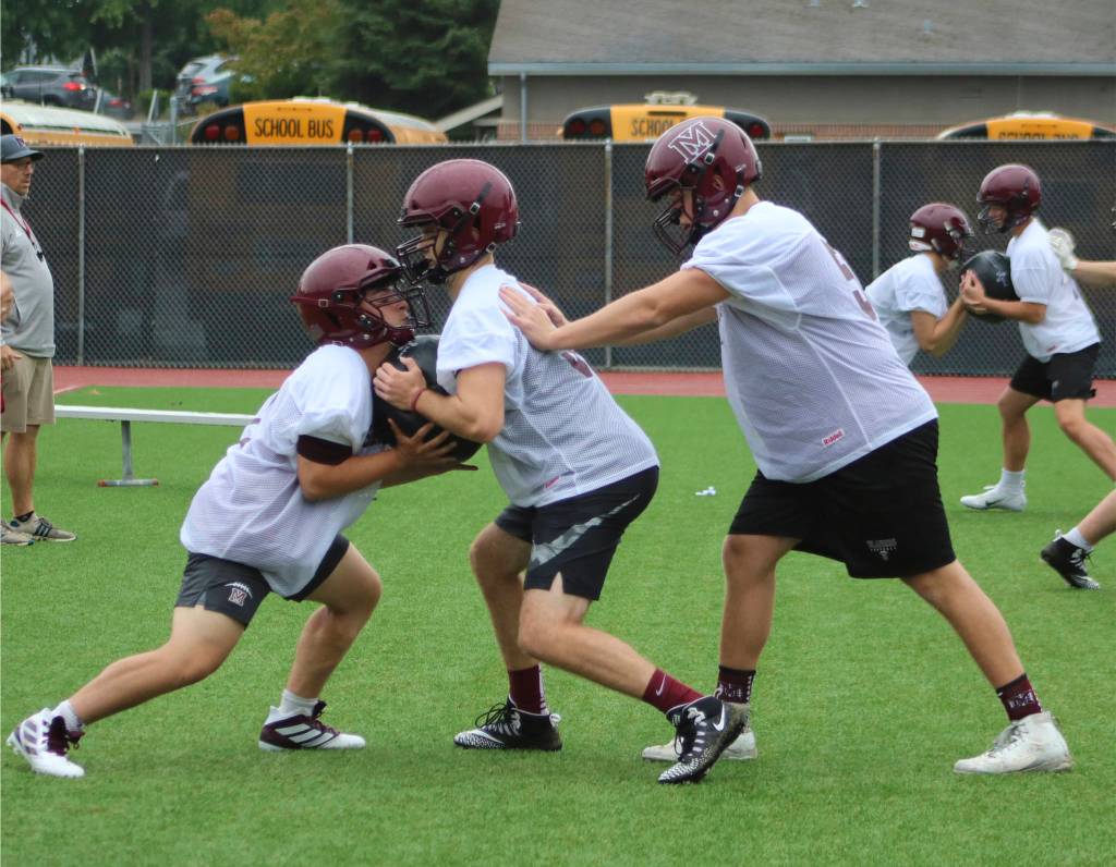 Linemen perform a drill during their first official practice. Benjamin Olson / staff photo