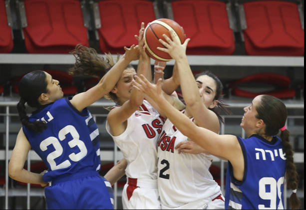 Angelina Barokas (white jersey on the right) pulls in a rebound at the 2019 European Maccabi Games in Hungary. Courtesy photo