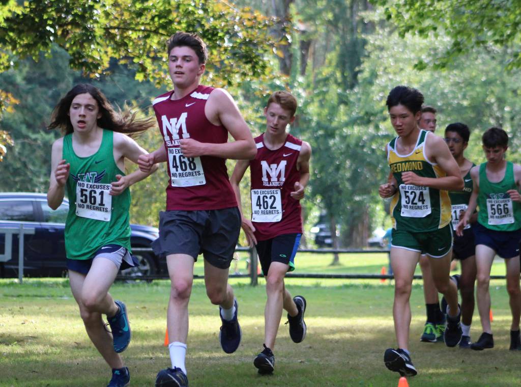 Mercer Island cross-country runners Everett Weeks (front, in red) and Jake Levin (back, in red) compete during the boys sophomore race at the KingCo Jamboree Class Race at Lake Sammamish State Park on Sept. 11. Benjamin Olson/ staff photo