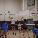 Freshman Leila Obeidat (No. 17) hits the ball while other freshman Samantha Silke (No. 3) looks for a block. Benjamin Olson/ staff photo
