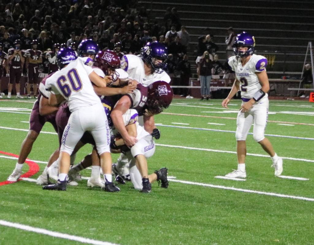 The Mercer Island defense tackles Issaquah running back Aiden Barnes in the Islanders 12-3 loss to the Eagles on Sept. 13. Benjamin Olson/ staff photo