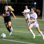 Mercer Island defender Avery Conder and Lake Washingtons Anna Schwisow both go for the ball in a 6-0 Lake Washington win on Oct. 26. Benjamin Olson/ staff photo