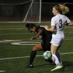 Mercer Island winger Jalyn Sandwith fights for the ball against Lake Washingtons Ari Issa in a 6-0 Islanders loss. Benjamin Olson/ staff photo