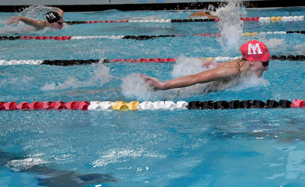 Mercer Island senior Ellie Bailey (pink cap) and sophomore Austin Whelan (black cap) swim the 200-meter individual medley during the Islanders victory over Sammamish on Oct. 3. Photo courtesy of Allison Nelson