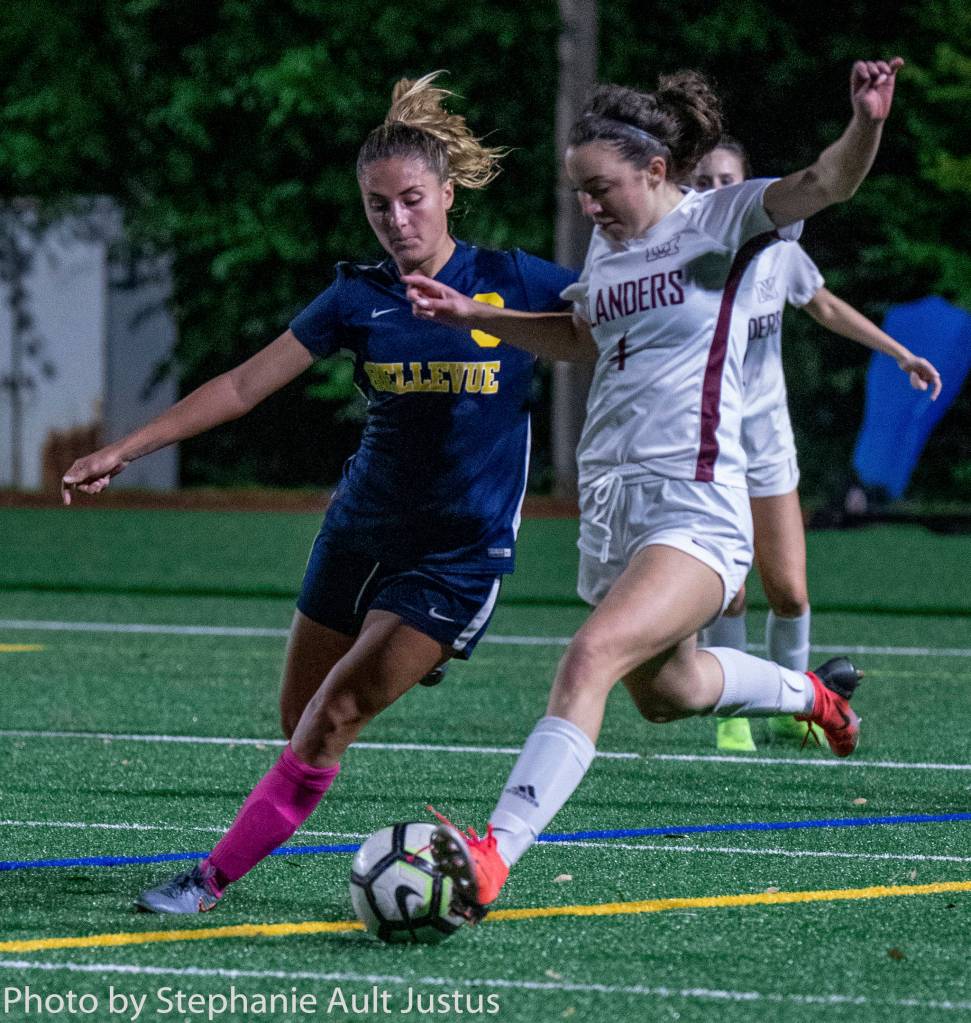 Mercer Island forward Kaija Szylko (4) winds up to kick the ball during a 1-1 tie against Bellevue on Oct. 7. Photo courtesy of Stephanie Ault Justus