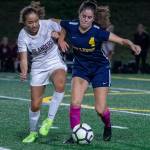 Mercer Island midfielder Emily Yang and Bellevue midfielder Audrey Miller fight for the ball during a 1-1 draw on Oct. 7. Photo courtesy of Stephanie Ault Justus