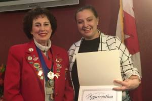 Photos courtesy of Carol Mahoney                                Club president Carol Mahoney gives a service appreciation award to Mercer Island Kiwanis Club board member Danielle Hawley of the Mercer Island Boys and Girls Club.