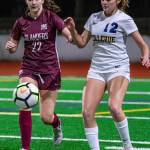 Mercer Island defender Scarlett Counihan (22) and Bellevue midfielder Morgan Pingree (12) both go for the ball during the Wolverines 3-0 win on Oct. 31. Photo courtesy of Stephanie Ault Justus