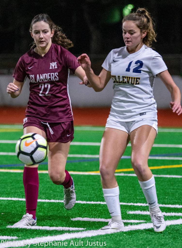 Mercer Island defender Scarlett Counihan (22) and Bellevue midfielder Morgan Pingree (12) both go for the ball during the Wolverines 3-0 win on Oct. 31. Photo courtesy of Stephanie Ault Justus