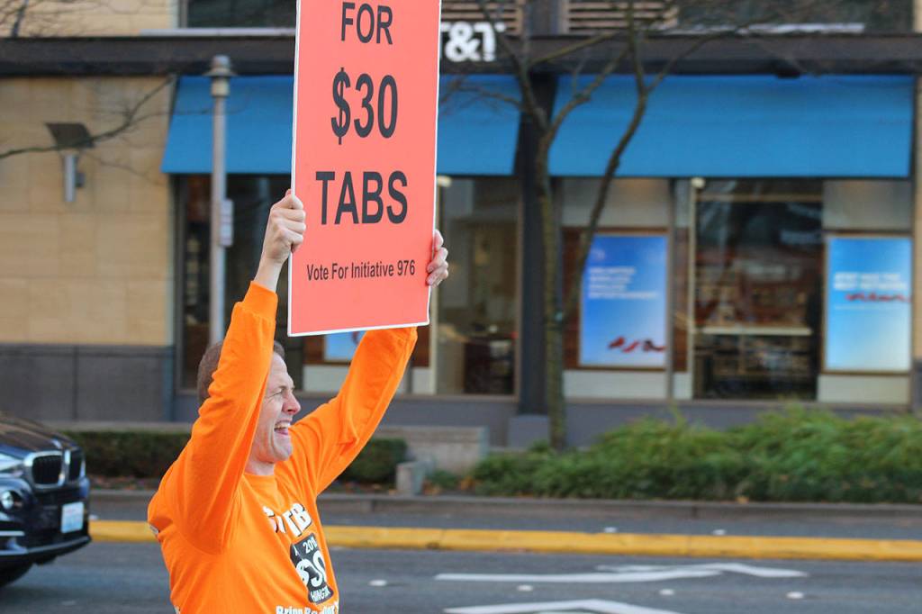 Tim Eyman get in some last minute campaigning for I-976 in downtown Bellevue on the afternoon of Nov. 5. The initiative would set car tabs at $30 statewide with opponents warning it would bankrupt transit projects across the state. Aaron Kunkler/staff photo