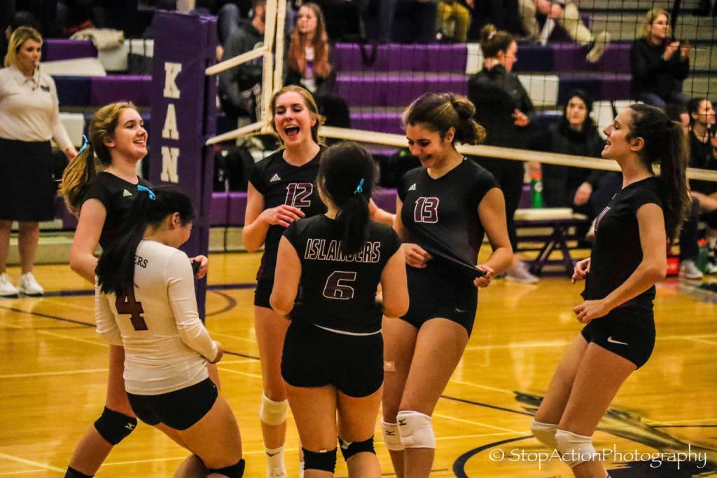 The Mercer Island volleyball team celebrates a point during a 3-2 loss to Lake Washington on Nov. 7. Photo courtesy of Don Borin/Stop Action Photography