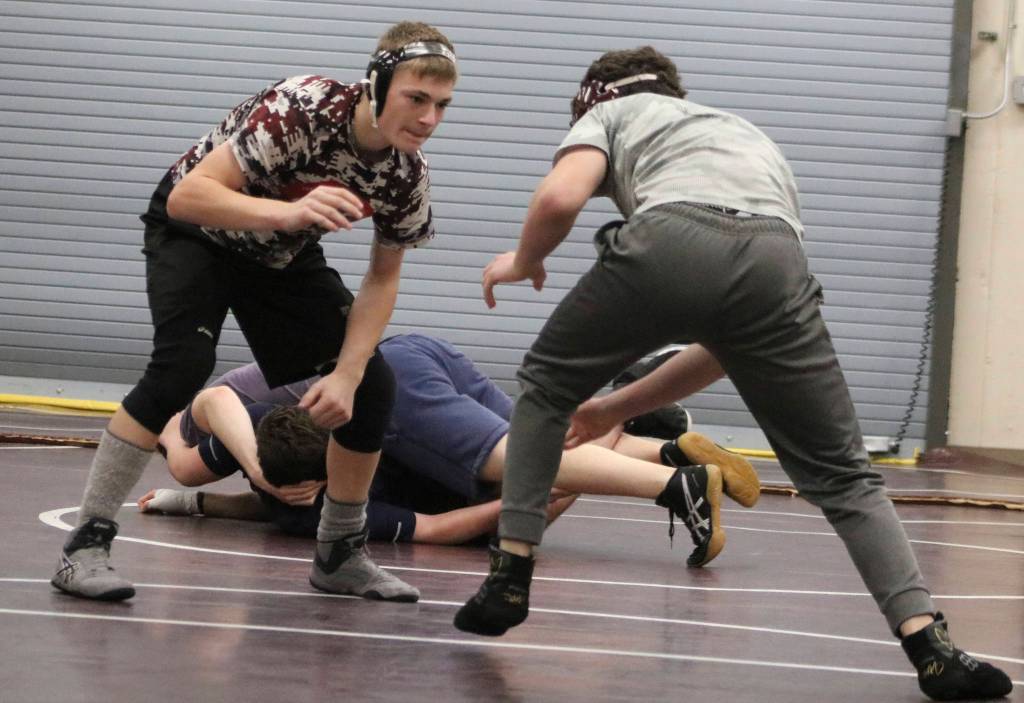 John Mangino and Chris Neal square off at a Mercer Island wrestling practice. Benjamin Olson/staff photo