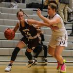 Mercer Island Grace Shaddle (left) scored 13 points in a loss to Issaquah on Dec. 4. Photo courtesy of Don Borin/Stop Action Photography