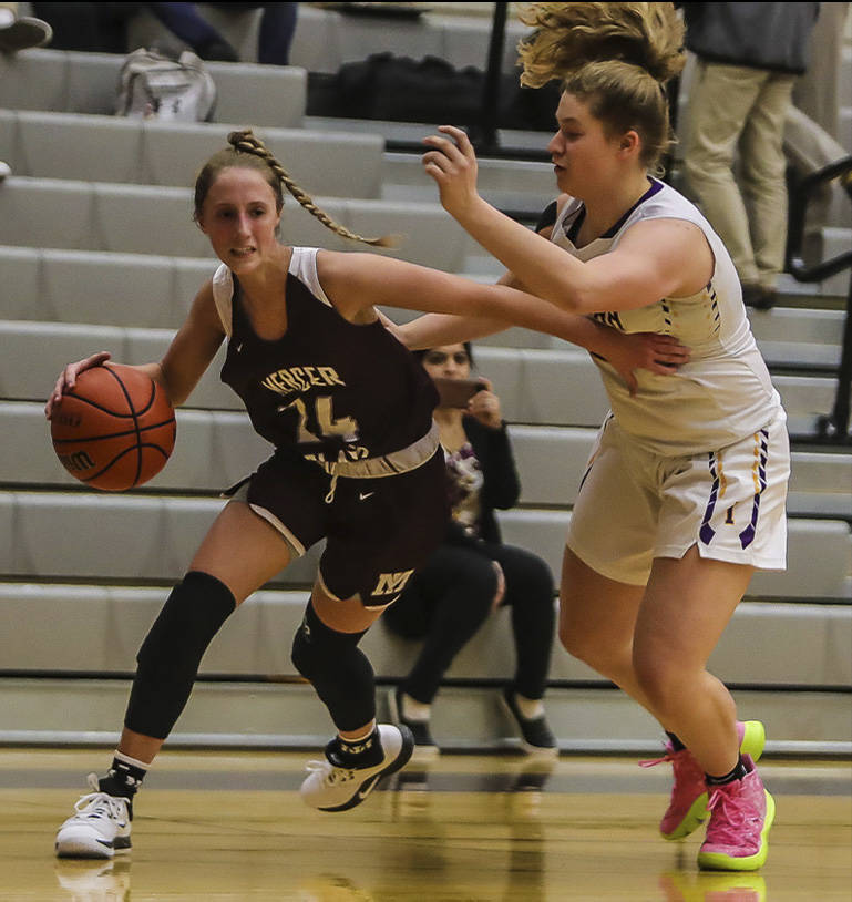 Mercer Island Grace Shaddle (left) scored 13 points in a loss to Issaquah on Dec. 4. Photo courtesy of Don Borin/Stop Action Photography
