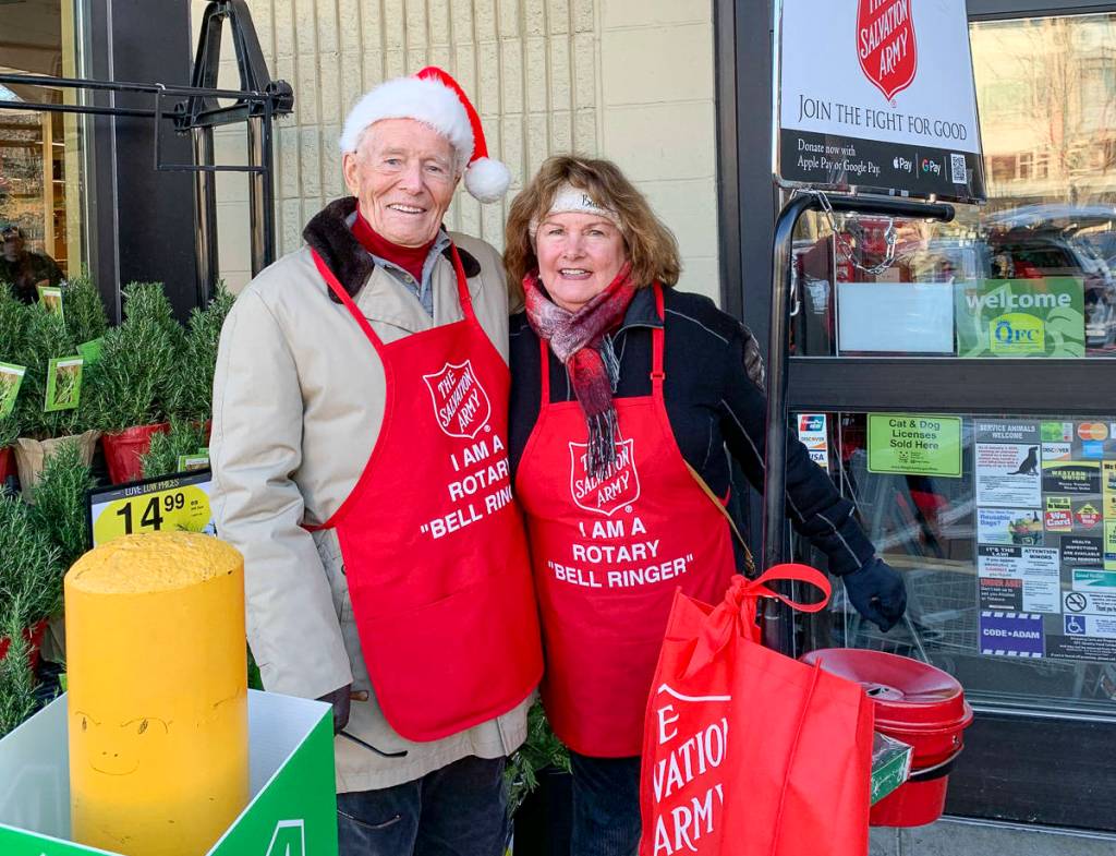 Courtesy photo                                 Mercer Island Rotary Club members Bruce McAuley and Karolyn Streck volunteering as bell ringers for the Salvation Army.