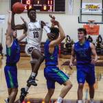 Mercer Island guard Nigel Seda (10) drives to the hoop during the Islanders 65-49 victory over the Liberty Patriots on Dec. 10. Photo courtesy of Don Borin/Stop Action Photography