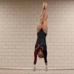 Mercer Island sophomore Rachel Ressmeyer performs giants on the bars. during a meet on Dec. 12, at Sammamish High School. Benjamin Olson/staff photo