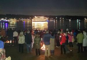 Beachgoers at Luther Burbank Park on Mercer Island enjoy a previous years performance of the Argosy Cruises Christmas Ship Festival. Courtesy photo