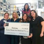At a Dec. 6 event, Pitch Your Peers (PYP) Seattle presented a grant award of $17,700 to Kindering. From left: Kindering community engagement officer Anna Brown, Kindering chief development officer Alison Morton, PYP grant champion  who pitched Kindering  Erin Azose, Kindering CEO Lisa Greenwald, PYP co-founder and president Erin Krawiec, Kindering assistant development director Jennifer Schumacher, and PYP co-founder and vice president Alison Burks. Courtesy photo.