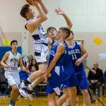 Northwest Yeshiva junior guard Dov Goldberg (shooting) takes a shot while teammate Victor Maimon (#1) looks on during the Lions 52-47 victory over Grace Academy on Dec. 14. Photo courtesy of Patrick Krohn/Patrick Krohn Photography
