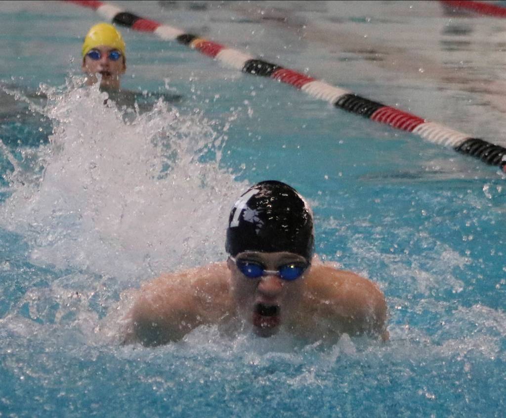Matt Williamson (black cap) is part of a talented group of freshmen swimmers for the Mercer Island boys swim and dive team. Benjamin Olson/staff photo