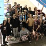 The Mercer Island boys swim and dive team celebrates with the Kentridge Invitational trophy after finishing first as a team on Jan. 11 in Federal Way. Courtesy photo