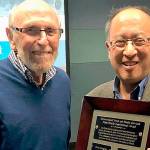 Courtesy photo                                Elliot Newman (left) receives his MIYFS Family Inspirational Award from Mayor Wong on Jan. 7.