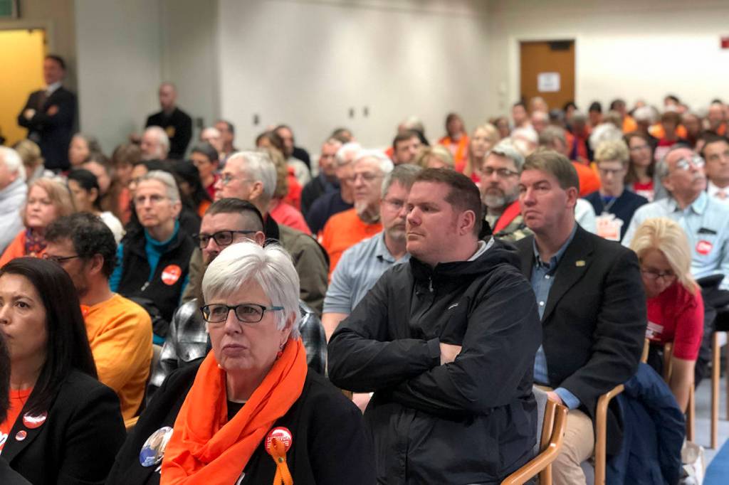 Photo by Leona Vaughn / WNPA News Service                                Washington residents at a Senate Law and Justice Committee hearing on a proposed ban on high capacity gun magazines this week. Many wore orange in support of gun safety.
