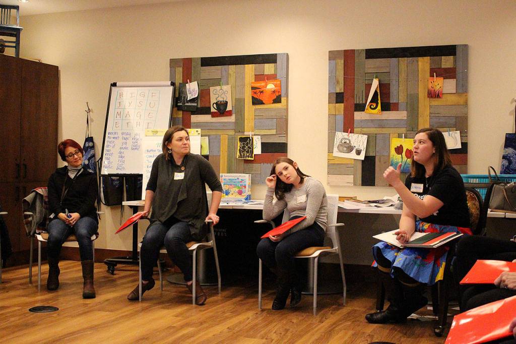 Madison Miller/staff photo                                YTN artistic director Mimi Katano, Silver Kite teaching artist Emily Bates, YTN student Lucie Henne and YTN director Rachel Carlson rehearse with other students and residents for the upcoming radio production of Gunsmoke.