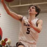 Mercer Island junior guard Tyler Butson makes a layup during the Islanders 61-36 win over Interlake on Feb. 11 at Sammamish High School. Butson finished with a game-high 13 points to help lead the Islanders to the 3A KingCo championship. Benjamin Olson/staff photo