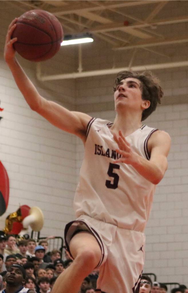 Mercer Island junior guard Tyler Butson makes a layup during the Islanders 61-36 win over Interlake on Feb. 11 at Sammamish High School. Butson finished with a game-high 13 points to help lead the Islanders to the 3A KingCo championship. Benjamin Olson/staff photo
