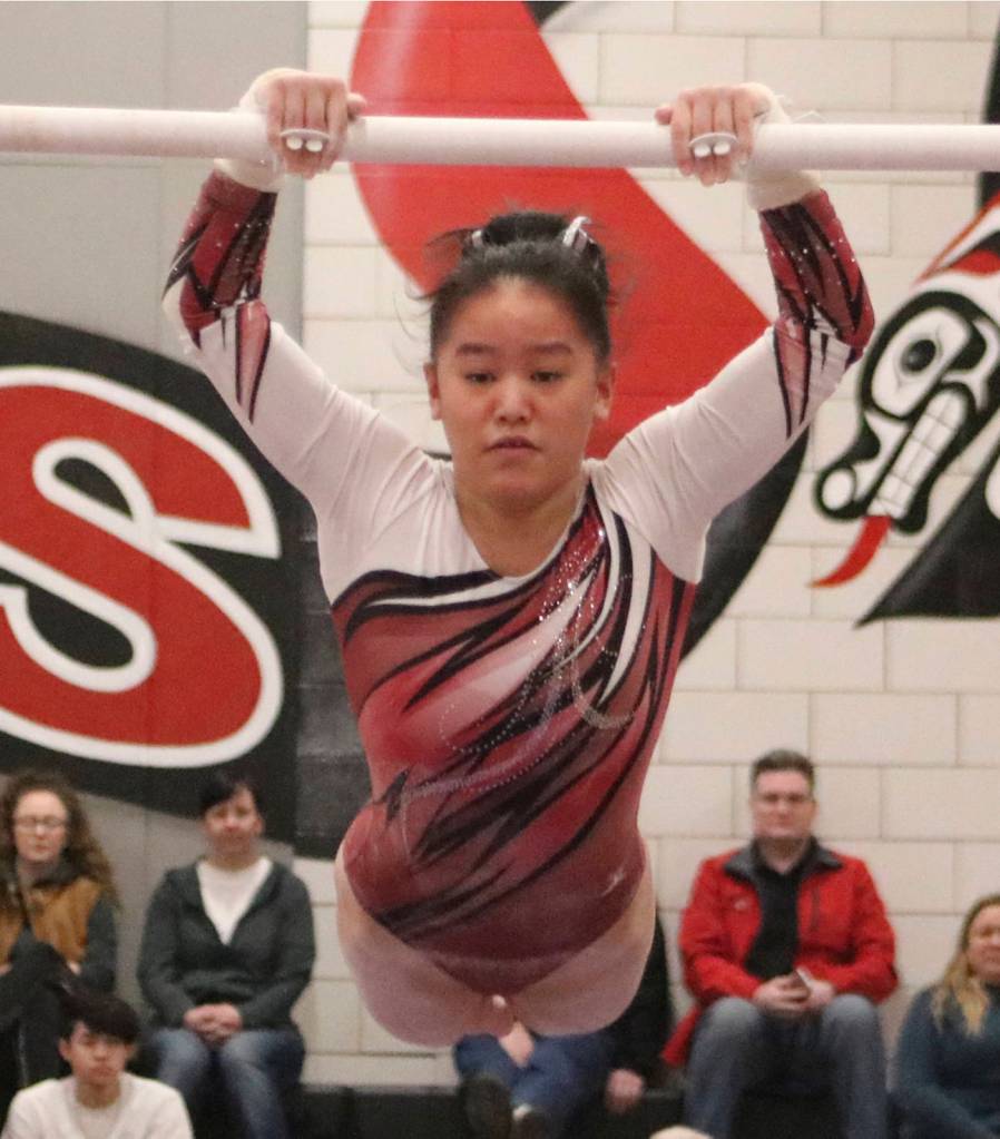 Mercer Islands Rachel Ressmeyer jumps onto the high bar during the event finals at the 1A/2A/3A state gymnastics meet on Feb. 21. Benjamin Olson/staff photo