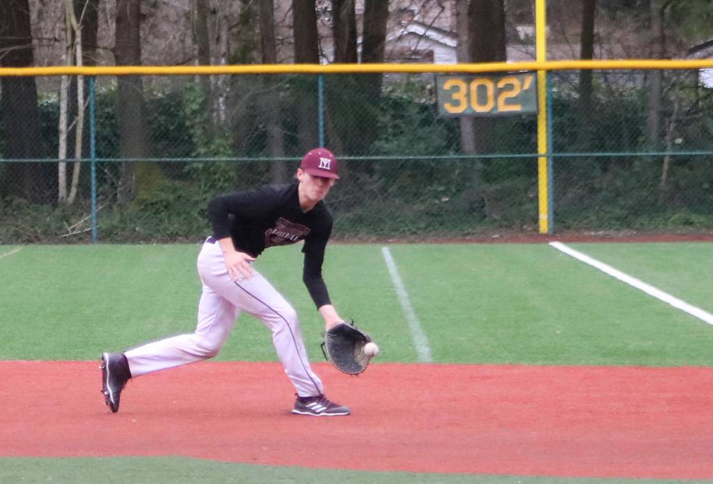 Mercer Island senior Nate Wenzel grabs a grounder during the Islanders practice on March 5 at Island Crest Park. Benjamin Olson/staff photo