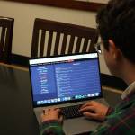 Mitchell Atencio/Staff Photo                                Avi Schiffmann looks over his website in a conference room at the Mercer Island Library on March, 6, 2020. Schiffmanns website has received visits from every country on earth.