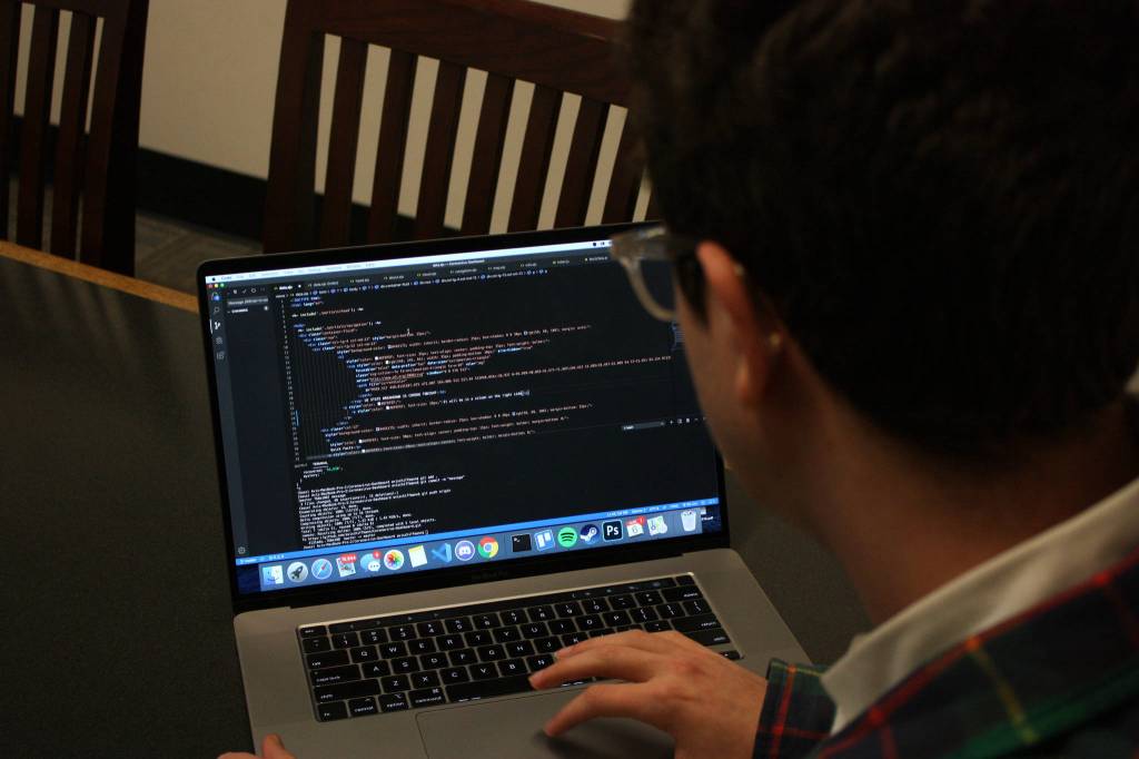 Avi Schiffmann works on his website in a conference room at the Mercer Island Library on March, 6, 2020. Mitchell Atencio/Staff Photo