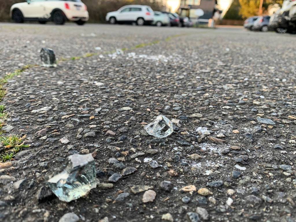 Glass on the ground of the former East Seattle Elementary School building parking lot. Natalie DeFord/staff photo