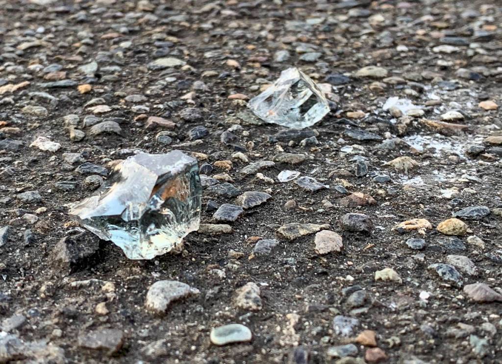 Thick chunks of broken glass in the parking area of the East Seattle Elementary School property. Natalie DeFord/staff photo