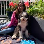 Photo courtesy Olivia Tomaselli                                Mercer Island High School sophomore Olivia Tomaselli with her dog, Cookie, and available merchandise. Fifty percent of profits accrued from Tie Dye for Black Lives Matter are directly donated to the BLM Global Network, with the rest going toward supplies.