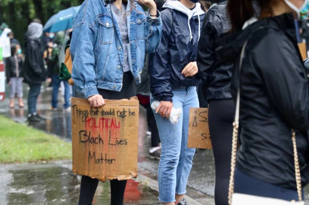 Protestors at the intersection of Island Crest Way and Southeast 40th Street. Blake Peterson/staff photo