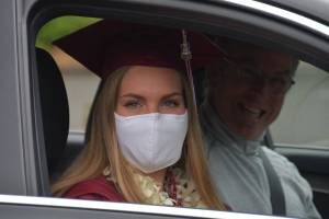 A Mercer Island High School senior at Junes drive-thru graduation ceremony. Photo by Joe Chen