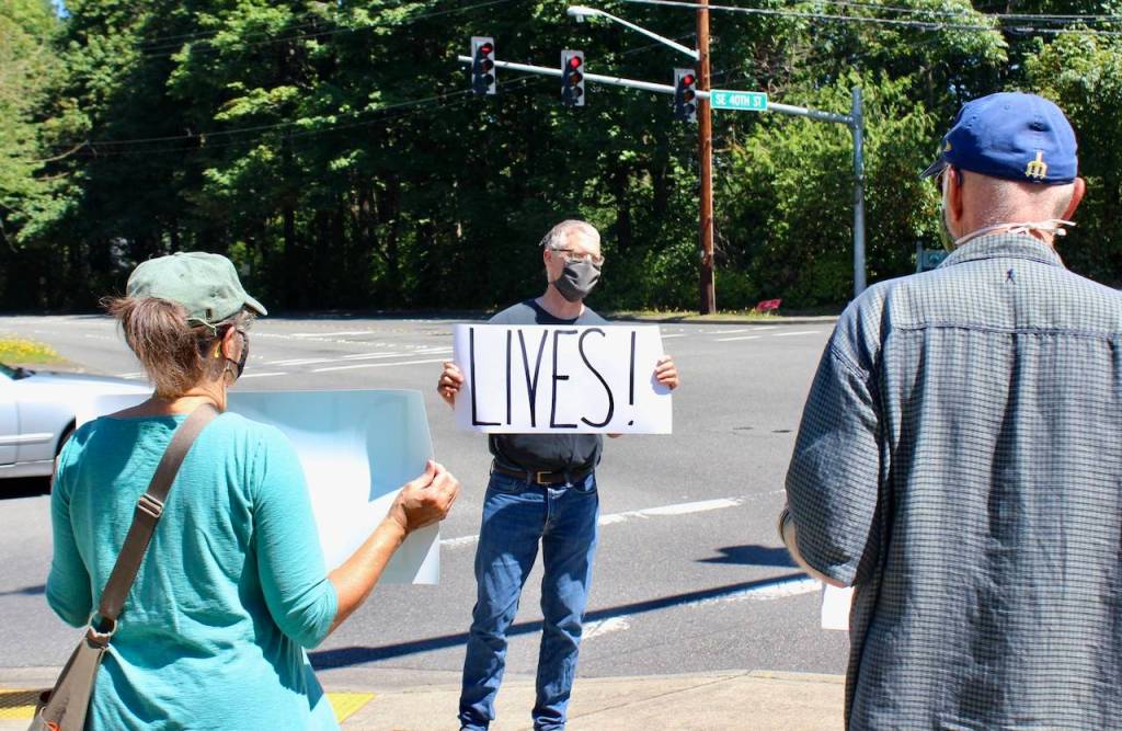 The brief strike was organized by community member Paul West (center). Blake Peterson/staff photo