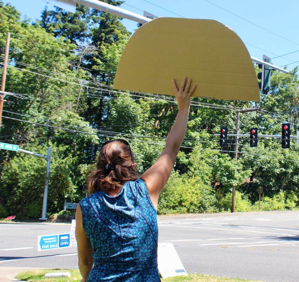 A protestor holds up a sign in support of Black lives. Blake Peterson/staff photo