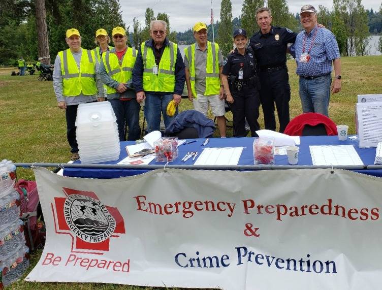 From Left to right at Mercer Island Emergency Preparedness Day on June 22, 2019 at Luther Burbank Park: Dallas Jolley, Pat Hackett, Jeff Peterson, Charles Johnson, Benson Wong (then city councilmember, now mayor), Mercer Island Police Department officer Jennifer Franklin (the police departments emergency preparedness officer), police commander Dave Jokinen and Woody Howse. Photo courtesy of the Mercer Island Radio Operators