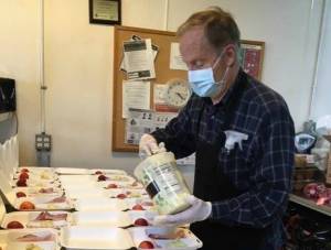Rotarians prepare meals for the homeless in Seattle