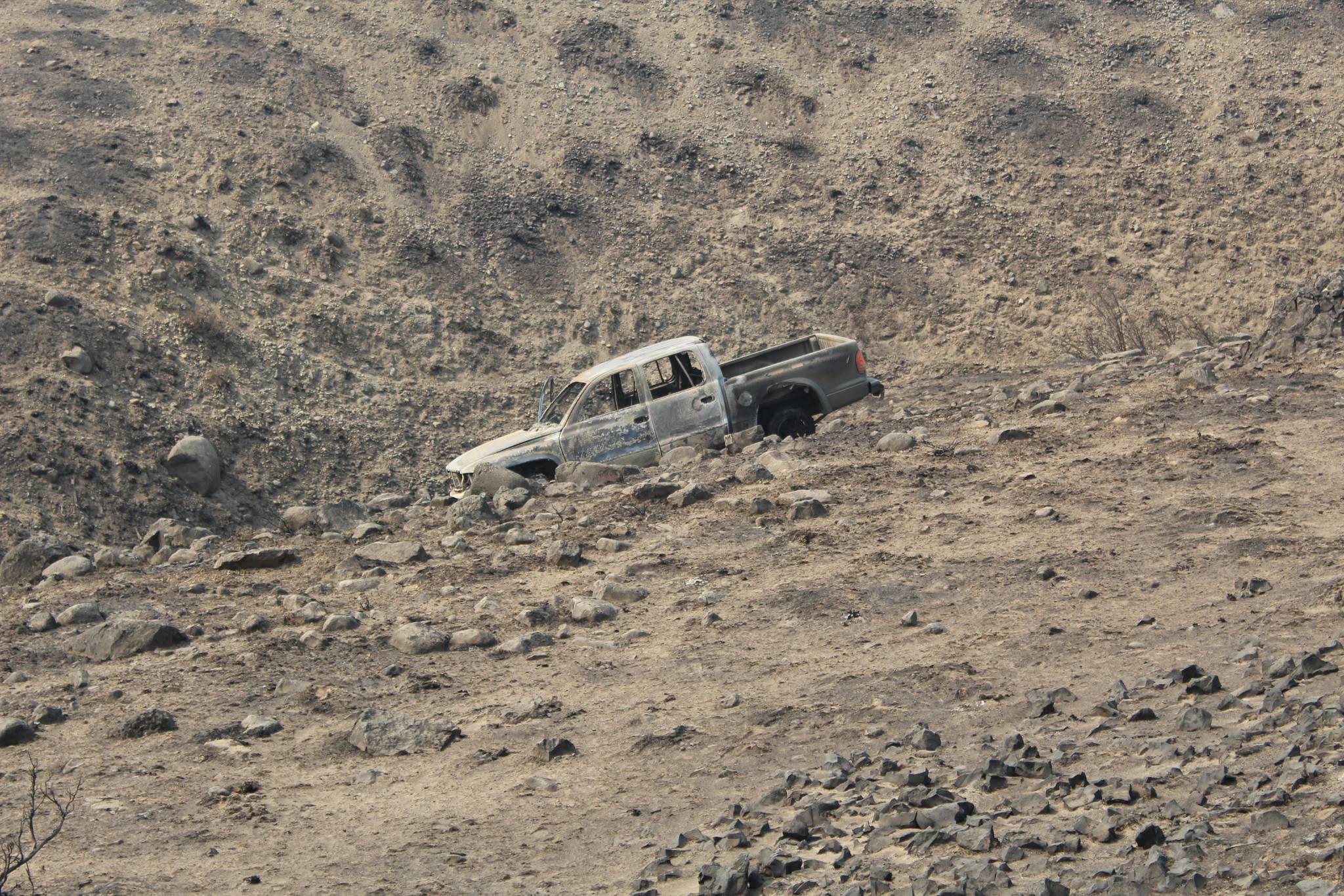 The truck of the Renton family as it was found Tuesday. While fleeing the Cold Springs Fire two adults were severely burned and one toddler died. Courtesy photo/Okanogan Sheriffs Office                                The truck of the Renton family as it was found Tuesday. While fleeing the Cold Springs Fire two adults were severely burned and one toddler died. Courtesy photo/Okanogan Sheriffs Office