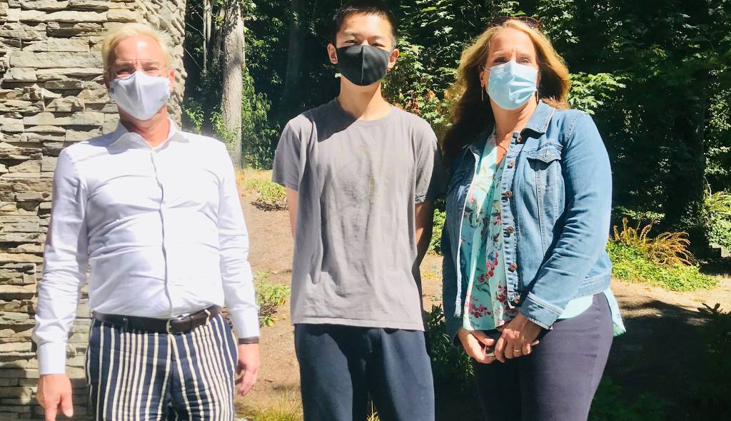 From left, Mercer Island High School principal Walter Kelly, National Merit semifinalist Kevin Wang and associate principal Lisa Deen. Photo courtesy of the Mercer Island School District